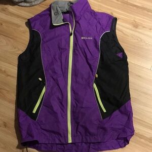 Sugoi cycling vest with magnets for visibility packs and lights.